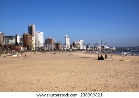 DURBAN, SOUTH AFRICA - DECEMBER 18, 2014: Many unknown people on Addington Beach against \