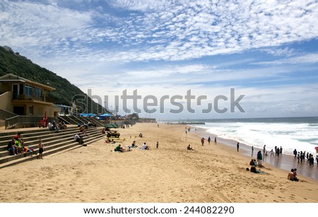 DURBAN, SOUTH AFRICA - DECEMBER 28, 2014: Many unknown visitors enjoy a sunny day on Brighton Beach in Durban, South Africa