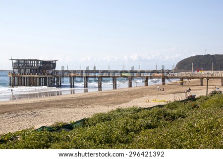 DURBAN, SOUTH AFRICA - JUNE 7, 2015: Many unknown people on Addington beach at Vetch\'s pier in Durban, South Africa