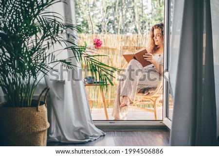 Similar – Image, Stock Photo balcony Reading Literature