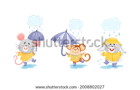 Smiling Animals Wearing Coat Walking on Puddles in Rainy Day with Umbrella Vector Set