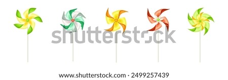 Similar – Image, Stock Photo Moving colored pinwheel on yellow background. Place to copy.