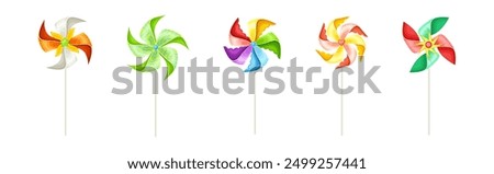 Similar – Image, Stock Photo Moving colored pinwheel on yellow background. Place to copy.