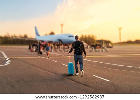 Similar – Image, Stock Photo Anonymous traveling man walking along wooden footbridge