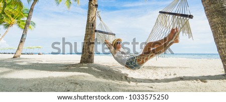 Similar – Image, Stock Photo Woman relaxing in hammock near lake