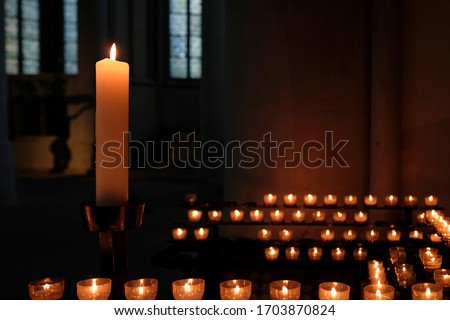 Similar – Image, Stock Photo One large candle and many small candles in a church