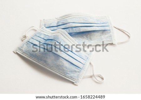 Similar – Image, Stock Photo blue single-use mask for virus protection on red background