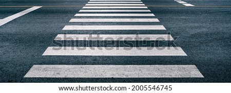 Similar – Image, Stock Photo Pedestrian crossing city downtown women walk in motion on road