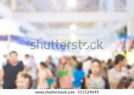 blurred image of exhibition show market product and crowd people