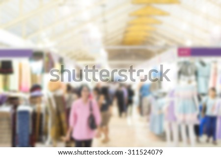 blurred image of exhibition show market product and crowd people