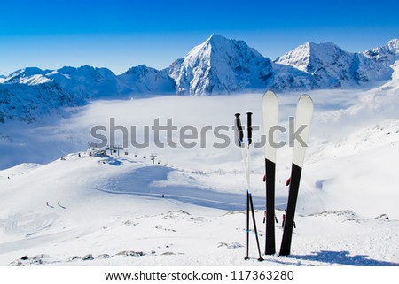 Skiing, winter season , mountains and ski equipment in the snow