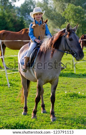 Ranch, horse riding - Portrait of lovely girl on a horse