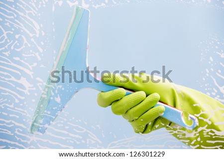 Cleaning - cleaning  pane with detergent, spring cleaning concept
