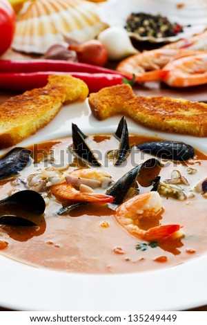 Bouillabaise, fish soup - traditional French fish soup with mussels and shrimp