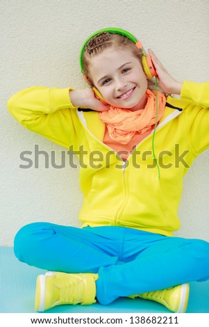 Young girl with headphones enjoying music . Lifestyle of young people concept.