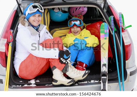 Winter, ski, journey - family with ski equipment ready for travel to ski resort