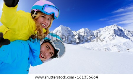 Ski - portrait of young skiers, couple having fun on ski