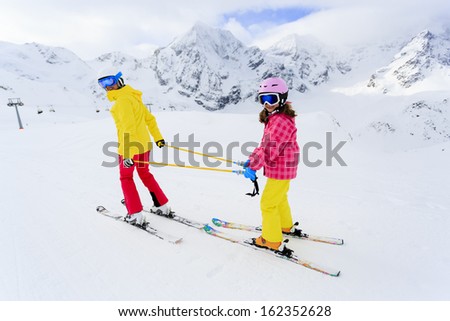 Ski, skiers on ski run - winter fun, child on ski lesson