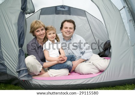 Happy family in tent