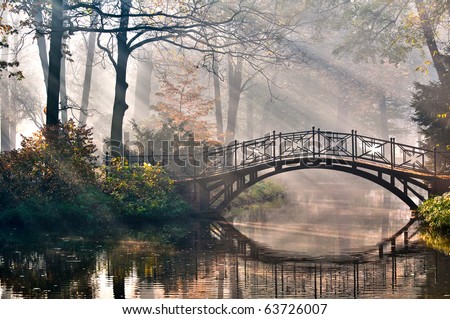 Old bridge in autumn misty park - HDR