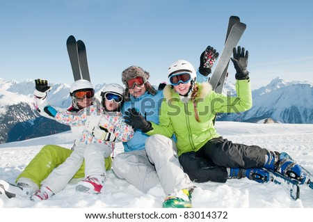 Winter, ski, sun and fun - happy family in ski resort