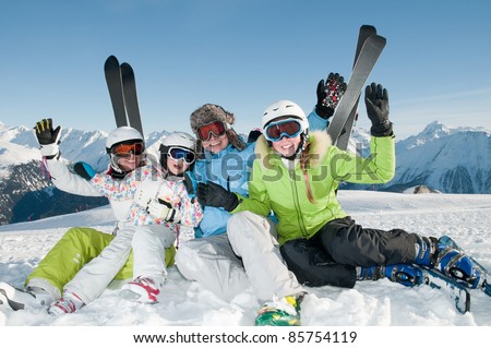 Winter, skiing - happy family in ski resort