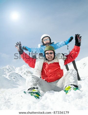 Skiers playing in snow