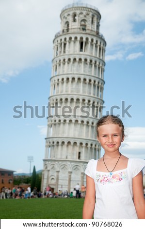Pisa - travel to famous places in Europe, portrait of beautiful girl, in background the Leaning Tower in Pisa, Italy