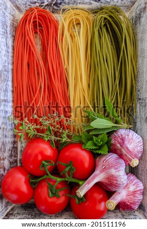 Italian cuisine - Italian tricolor pasta and ingredients