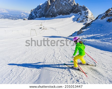 Skiing, winter, ski lesson - young skier on mountainside