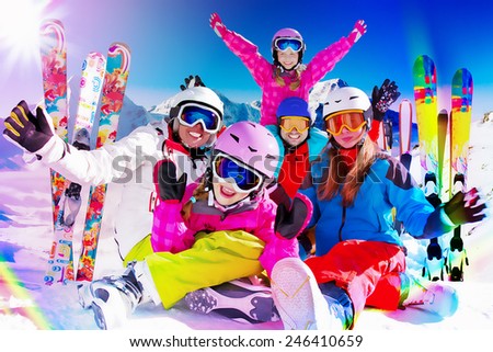 Skiing, winter, snow, skiers, sun and fun - family enjoying winter vacations, filtered