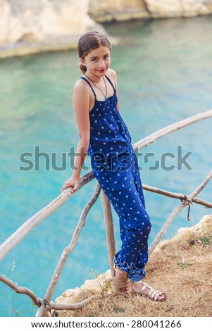 Summer vacation, portrait of lovely fashion young girl on the beach