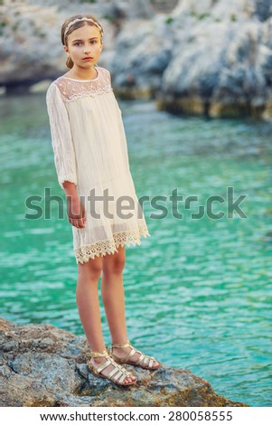 Summer vacation, portrait of lovely fashion young girl on the beach