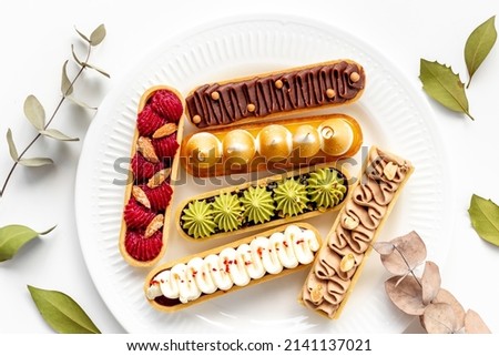 Set of french dessert eclairs with colorful topping ストックフォト © 