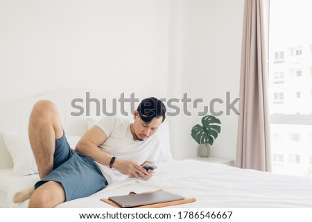 Similar – Image, Stock Photo Man lying down holding mirror with reflection