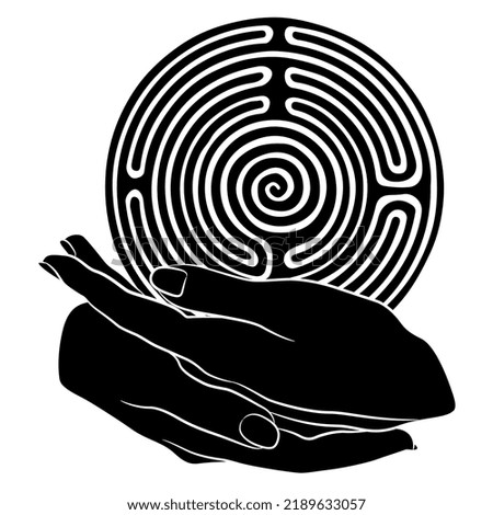 Two beautiful female hands holding a round spiral maze or labyrinth symbol. Ariadne. Creative concept. Black and white silhouette.