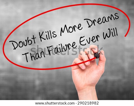 Man Hand writing Doubt Kills More Dreams Than Failure Ever Will with black marker on visual screen. Isolated on grey. Business, technology, internet concept. Stock Image