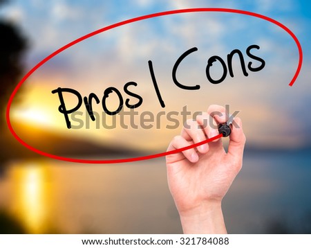 Man Hand writing Pros  Cons with black marker on visual screen. Isolated on nature. Business, technology, internet concept.