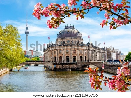 Similar – Image, Stock Photo Summer in Berlin. The stand-up paddlers on the Spree have the goal Oberbaumbrücke clearly in sight. From afar, the television tower of Alexanderplatz greets them.