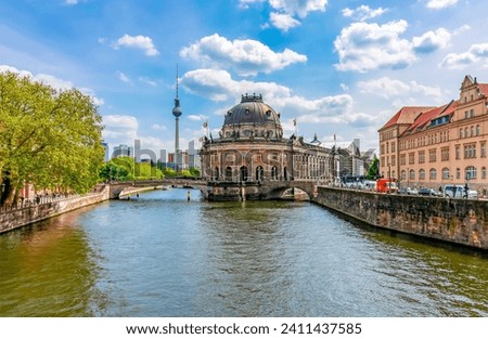 Similar – Image, Stock Photo Summer in Berlin. The stand-up paddlers on the Spree have the goal Oberbaumbrücke clearly in sight. From afar, the television tower of Alexanderplatz greets them.