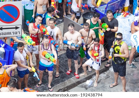 BANGKOK - APRIL 14,2014: A water fight during Songkran Festival celebrations on Silom Road in Bangkok Thailand.