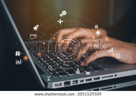 Businesswoman using a computer to AR virtual screen dashboard with project management with icons of scheduling, budgeting, communication. Stockfoto © 