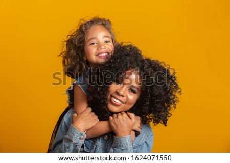 happy mother's day! Adorable sweet young afro-american mother with cute little daugh. 