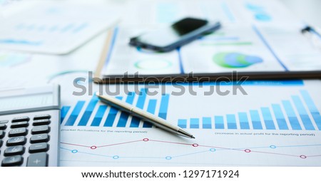 Financial statistics documents ball pen infographics at office table closeup. Internal Revenue Service inspector sum check investigation exchange market earnings savings loan and credit concept Foto stock © 