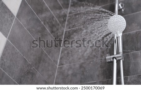 Similar – Foto Bild Duschkopf mit fließendem Wasser im Badezimmer