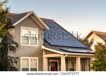 Solar photovoltaic panels on a house roof Stockfoto © 