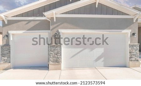 Similar – Image, Stock Photo Three garages in a residential area, one of them is open