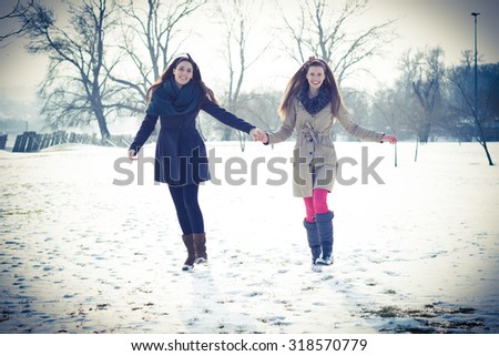 Best friends taking a walk on a beautiful cold winter day