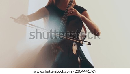 Similar – Foto Bild Nahaufnahme einer Violine mit Bogen. Braune Orchestergeige. Finger auf der Tastatur der Violine.