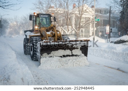 BOSTON, MA - FEBRUARY 15, 2015: The fourth major winter storm in as many weeks brings heavy snowfall and blizzard conditions, road crews work endlessly to clear snow-congested roads